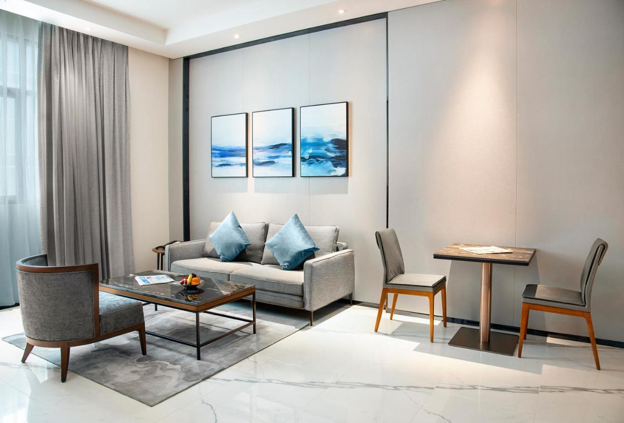 Asiana Grand Hotel Dubai Esterno foto A living room at the hotel