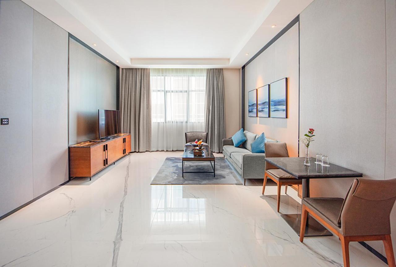 Asiana Grand Hotel Dubai Esterno foto A living room in a serviced apartment in Beijing, China